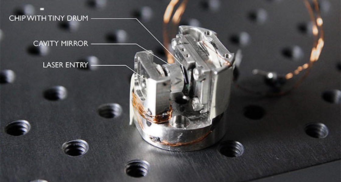 A vibrating square drum (0.5-mm on a side) inside an optical cavity.