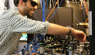 JILA Fellow and NIST Physicist Adam Kaufman at work in his lab