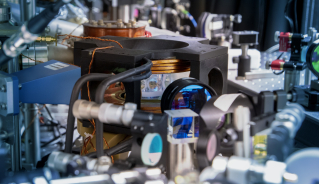 A round glass cell (centre, in black frame) is designed to hold a gas of molecules cooled to 50 billionths of a Kelvin. 