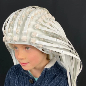 Child wears a helmet made up of more than 100 OPM sensors.