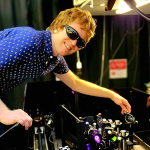 McBennett adjusting a wedge, which is an optic that reflects only a small fraction of the laser beam and transmits the rest. This allows imaging of a beam mode on a CMOS (complementary metal oxide semiconductor) camera, which would otherwise be damaged by the full laser power.