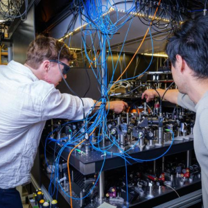 JILA researchers Lukin Yelin and Cao in the Kaufman lab at JILA. (Credit: Patrick Campbell/CU Boulder)
