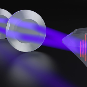 A diffractive optic creates two DUV beams, which are focused and interfered on a sample surface (diamond) using a 4f imaging system to generate a microscopic sinusoidal excitation profile.