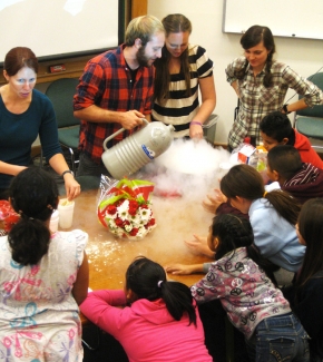 Photograph of the PISEC group teaching science in a grade school.