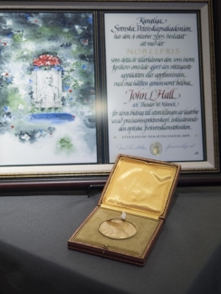 Photograph of Jan Hall's Nobel medal.
