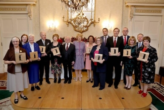 Photograph of Murnane being honored by Ireland’s President Michael D Higgins.