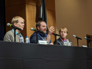 (L to R): JILA Fellow and CU Boulder Engineering professor and CSO of Infleqtion Dana Anderson listens to Maybell Quantum CEO and Founder Corban Tillmann-Dick respond to a question from the moderator at the Conference of World Affairs in April 2024. 