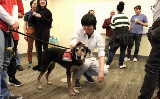 Charma, one of the therapy dogs from Go Team Therapy Dogs, makes a visit to JILA