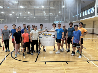 A photo of the final scoreboard in the badminton tournament for the JILA Cup