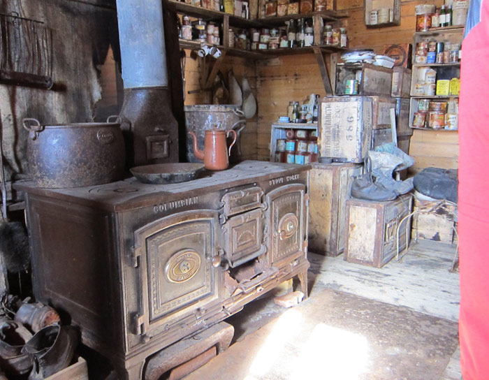 Cooking stove in rustic cabin.