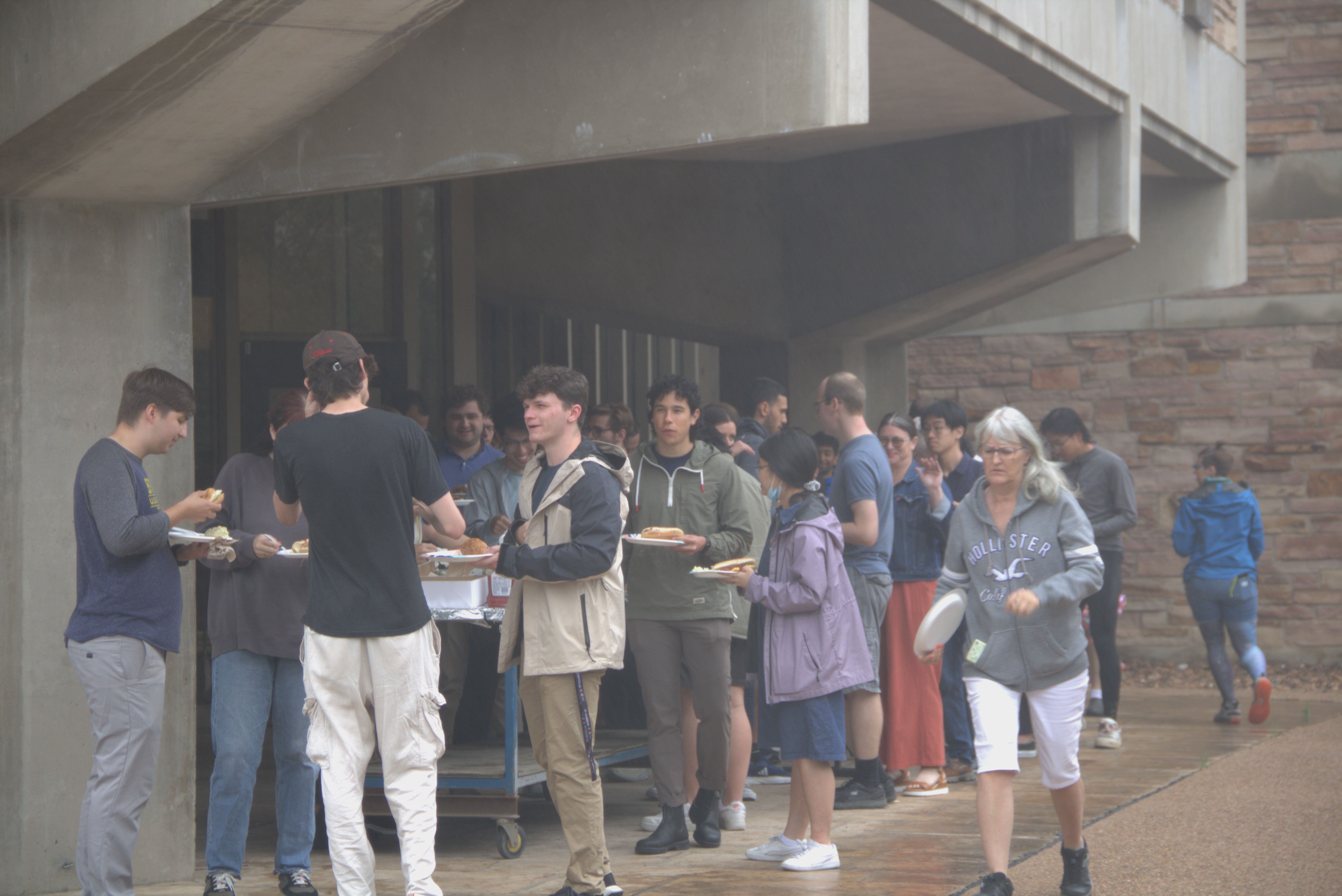 JILAns seek shelter under the tower during the light rain.