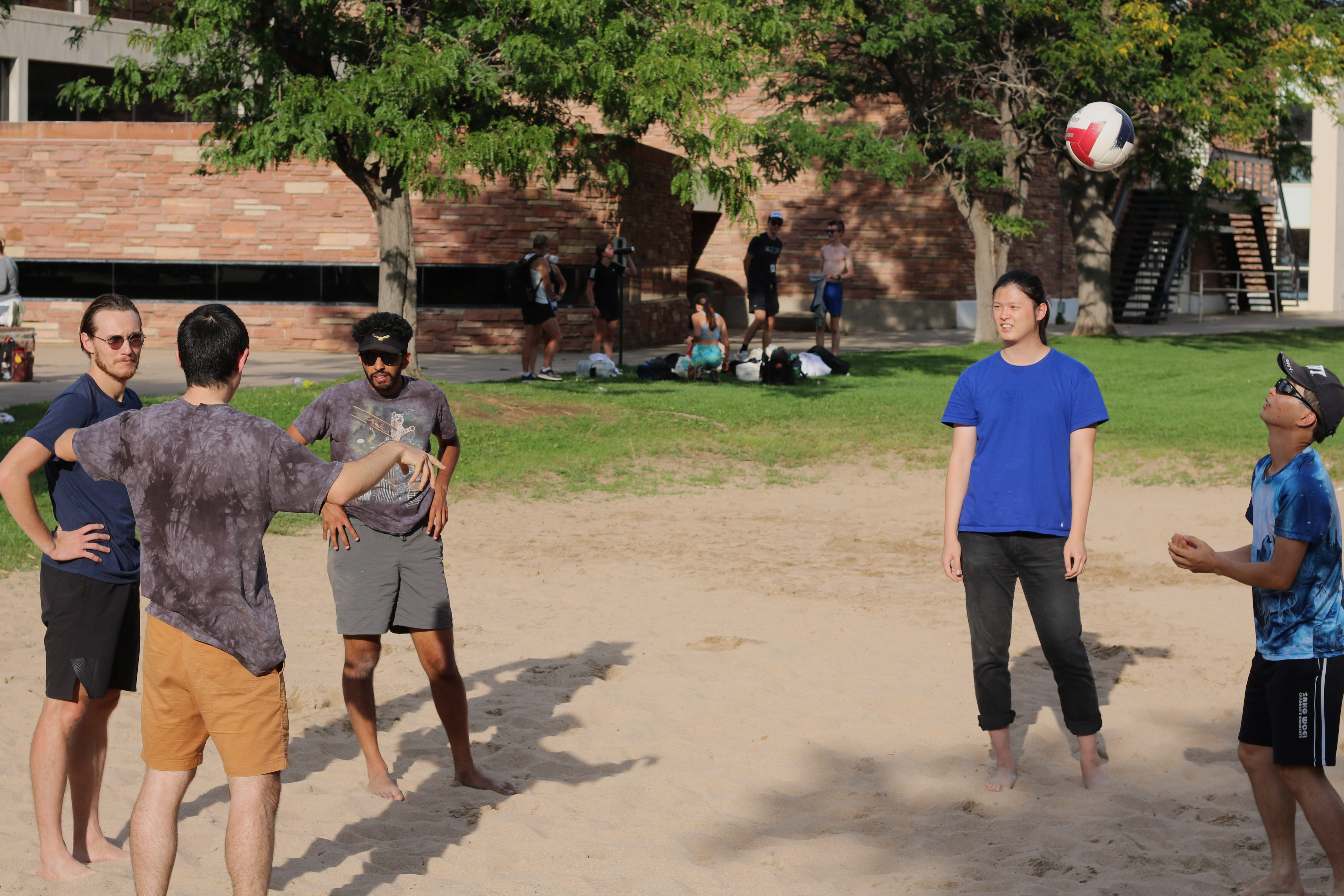 The Lehnert and Regal Groups battle it out on the beach volleyball court