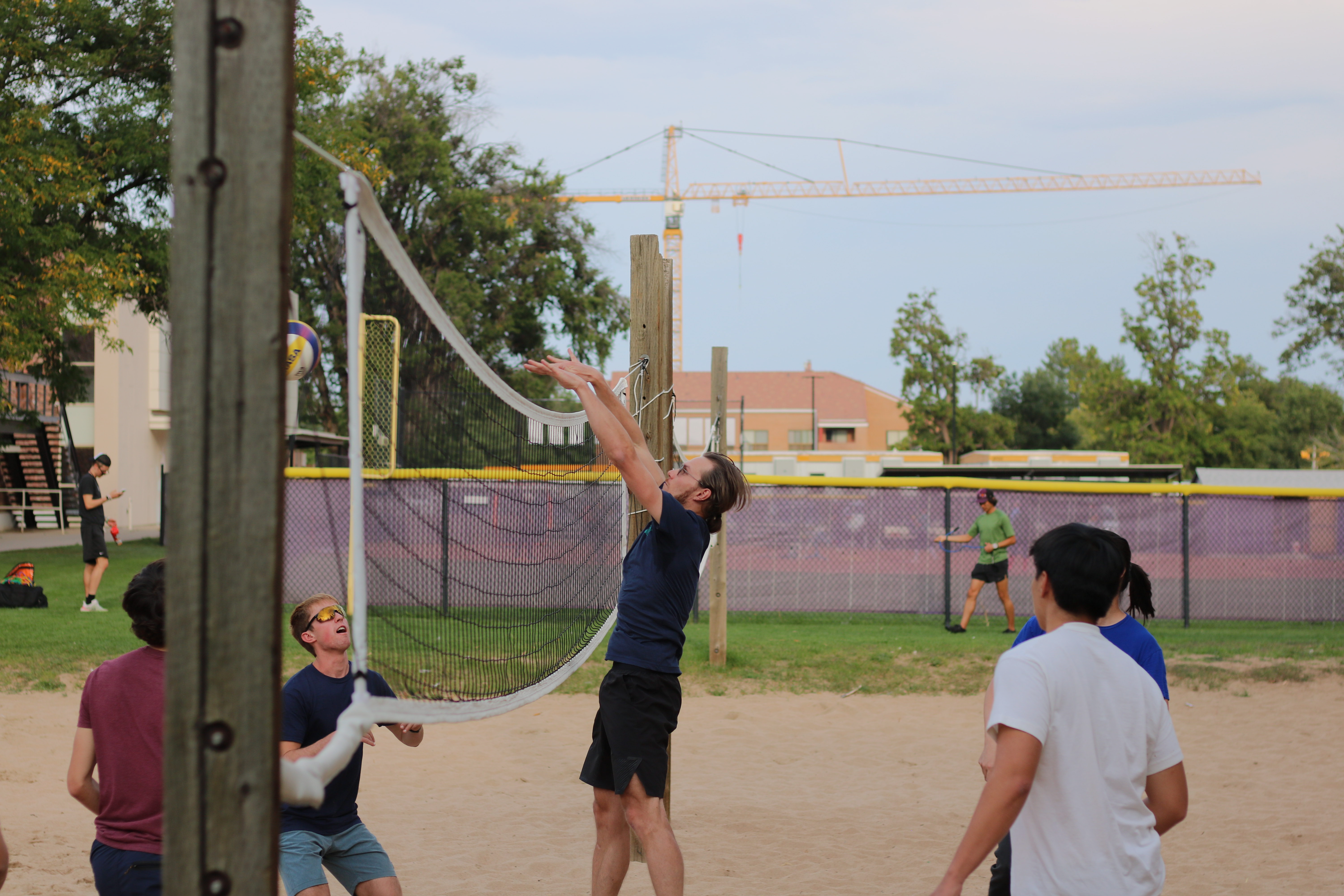 The Lehnert and Regal Groups battle it out on the beach volleyball court