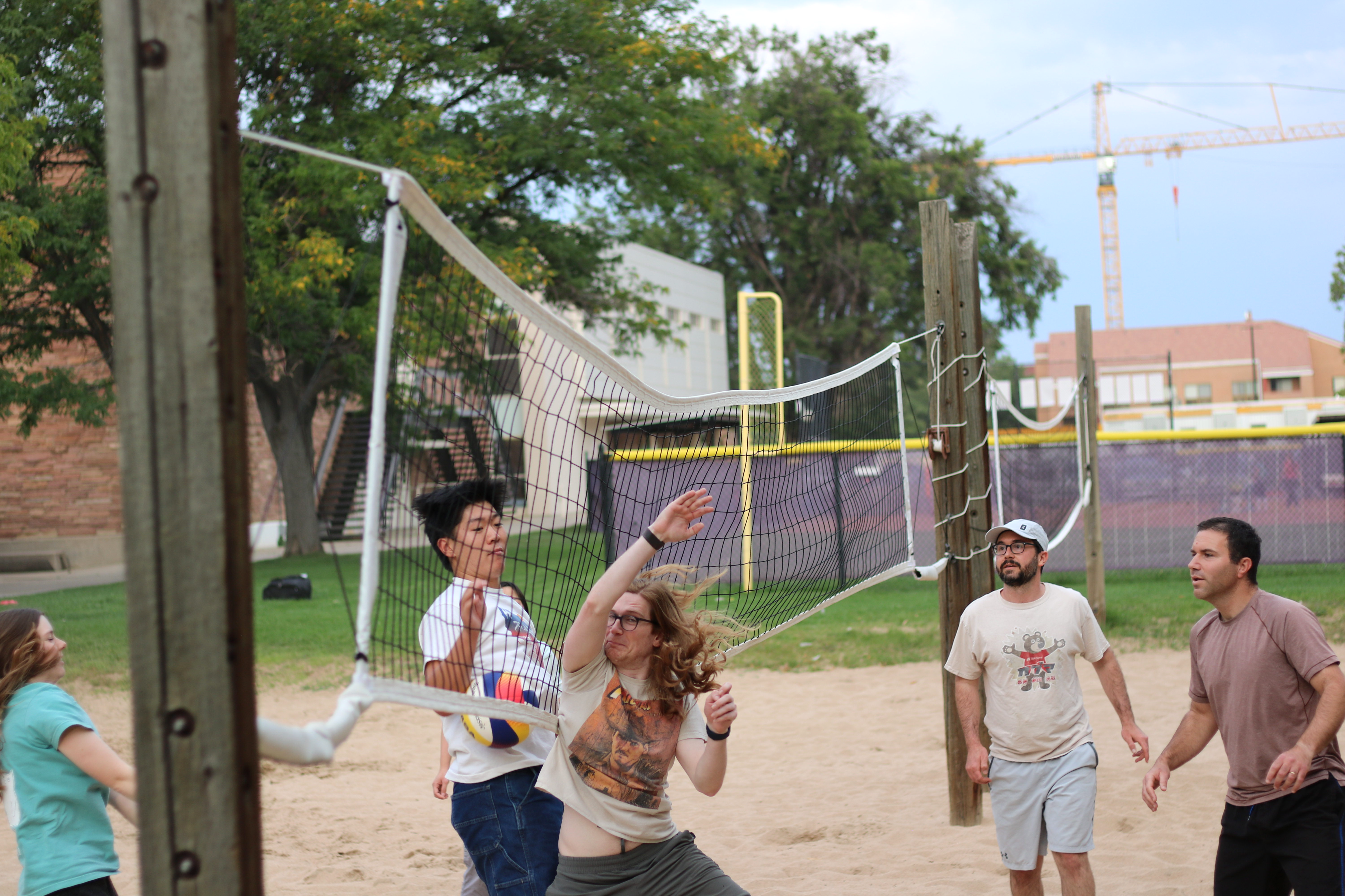 The Lehnert and Regal Groups battle it out on the beach volleyball court