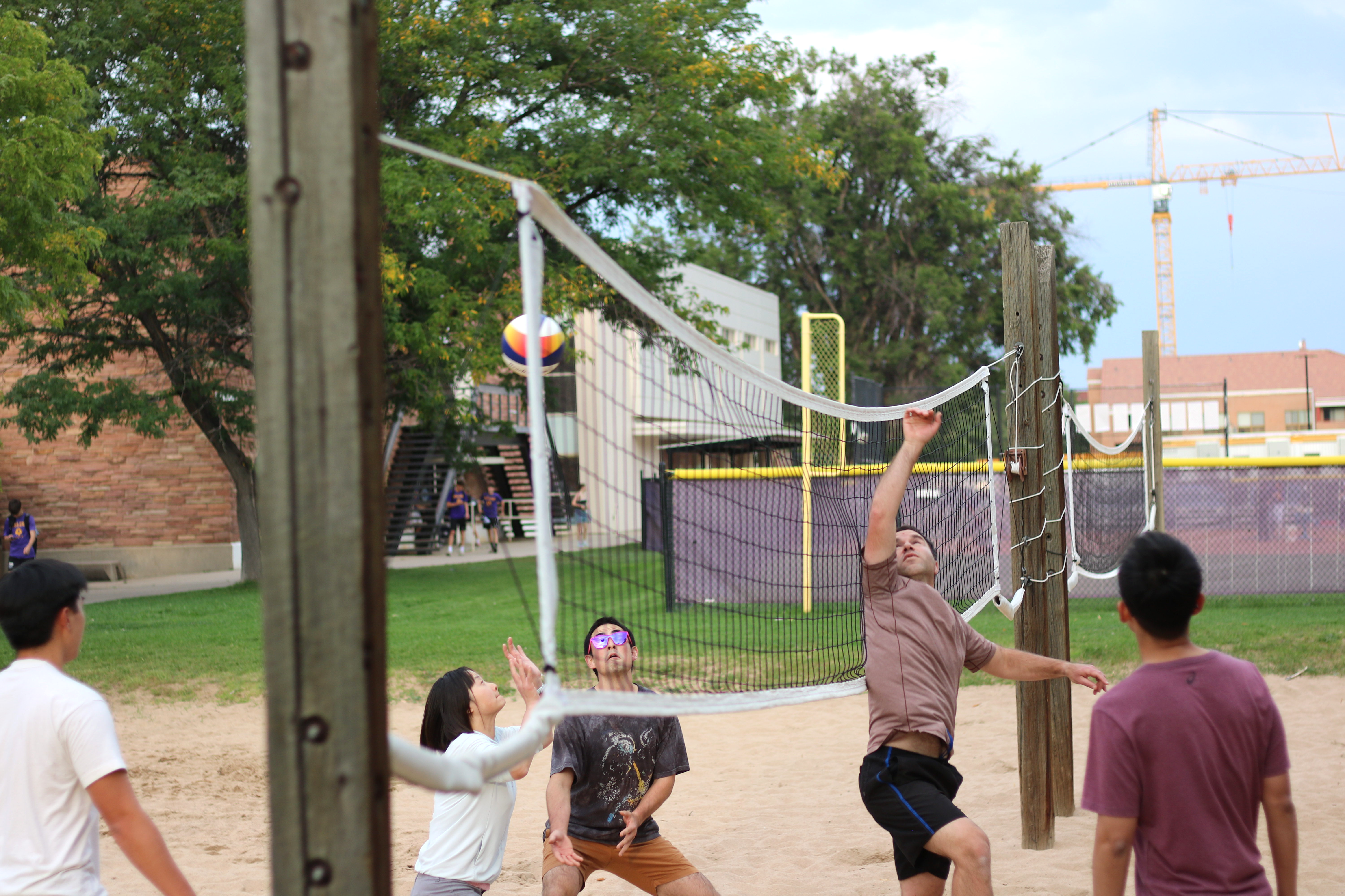 The Lehnert and Regal Groups battle it out on the beach volleyball court