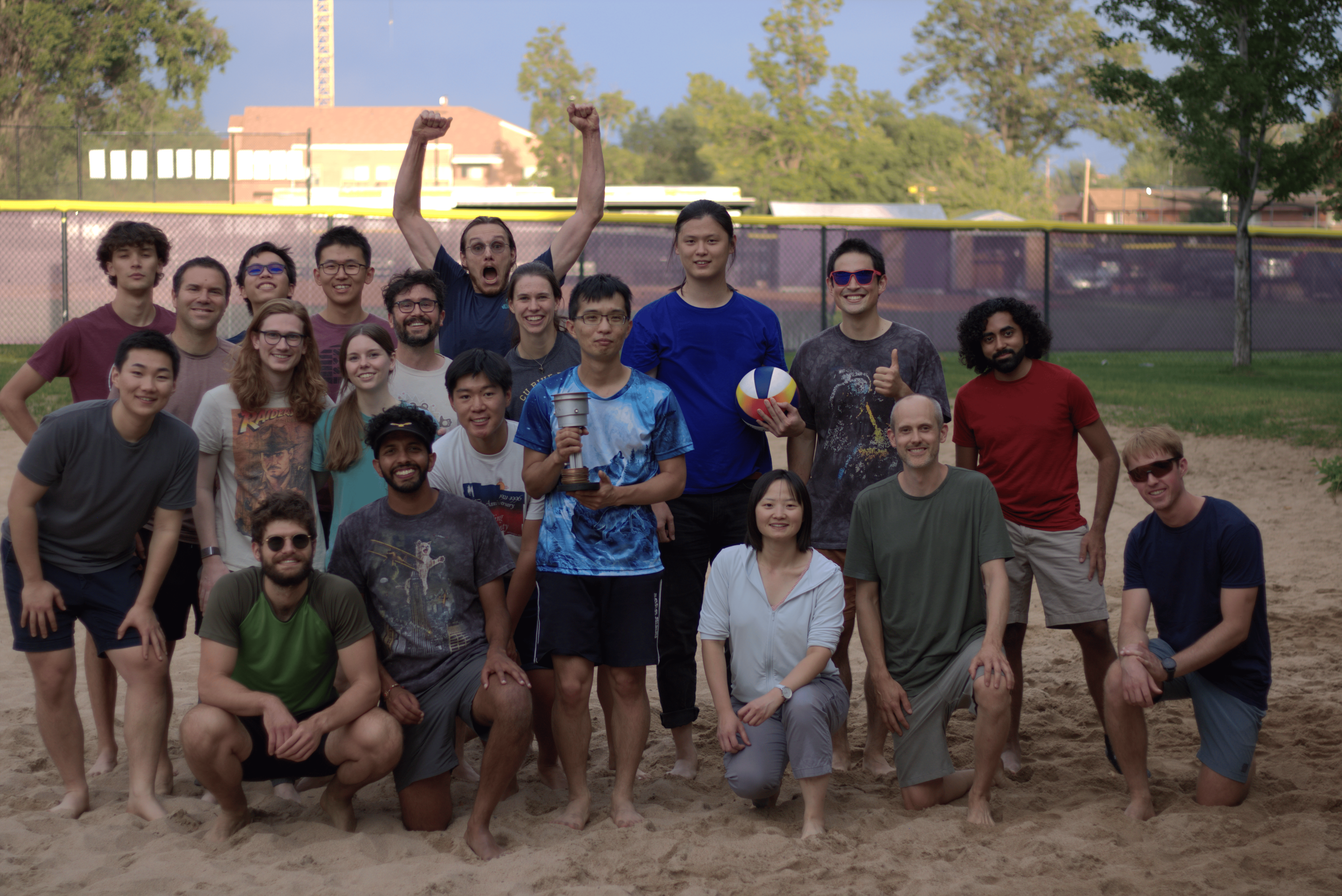 The Lehnert and Regal Groups celebrate a hard-fought showdown in beach volleyball