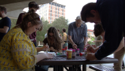 JILA staff member Hannah Douglas (left) and JILA Fellow Judah Levine (back) decorate cookies as part of JILA's Sugar Cookie Day
