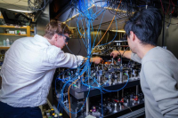 JILA researchers Lukin Yelin and Cao in the Kaufman lab at JILA. (Credit: Patrick Campbell/CU Boulder)
